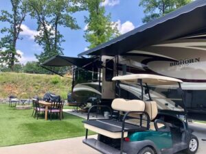 Rv site with fire pit and golf cart